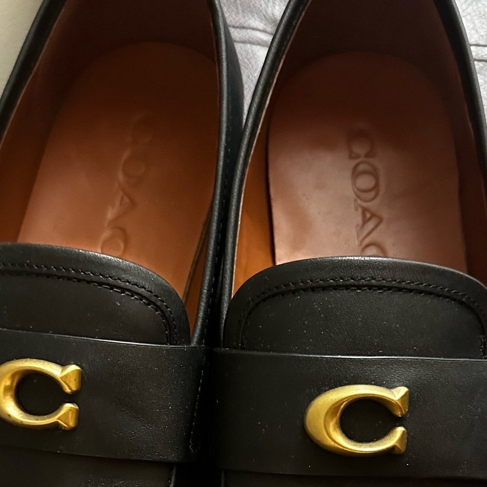 Men’s leather coach shoes with gold emblem